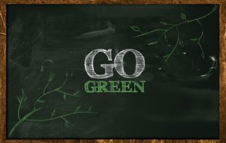 Go Green Text on blackboard