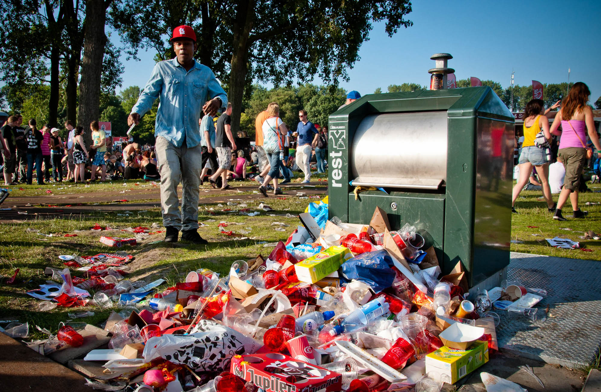 Car battery with green recycle sign.