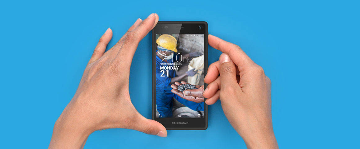 Car battery with green recycle sign.