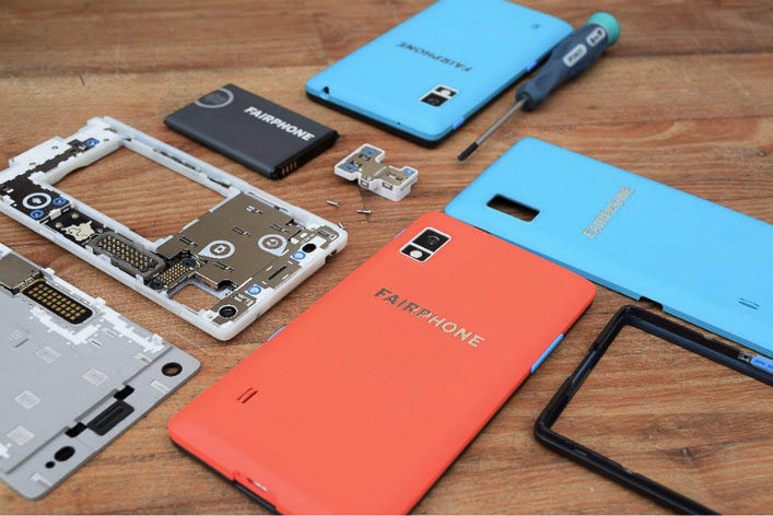 Car battery with green recycle sign.