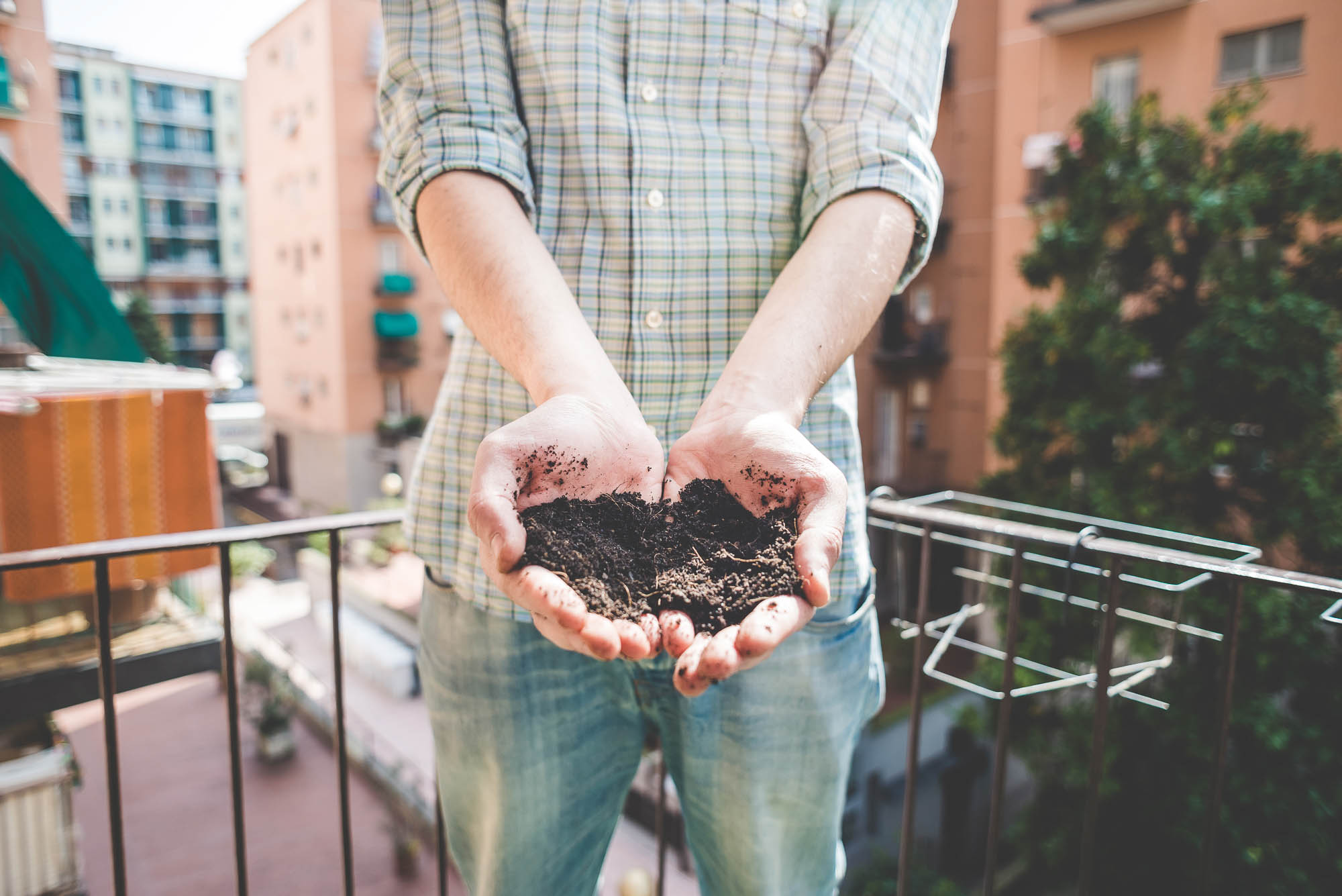 Car battery with green recycle sign.