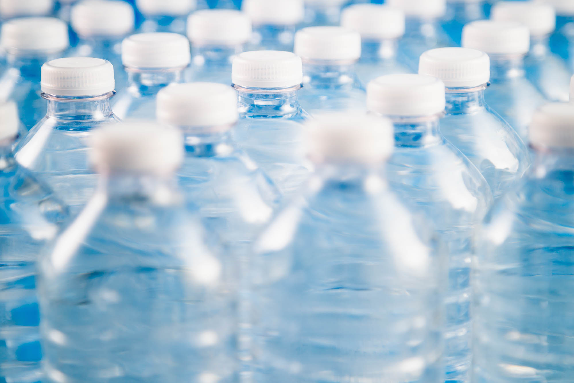 Car battery with green recycle sign.