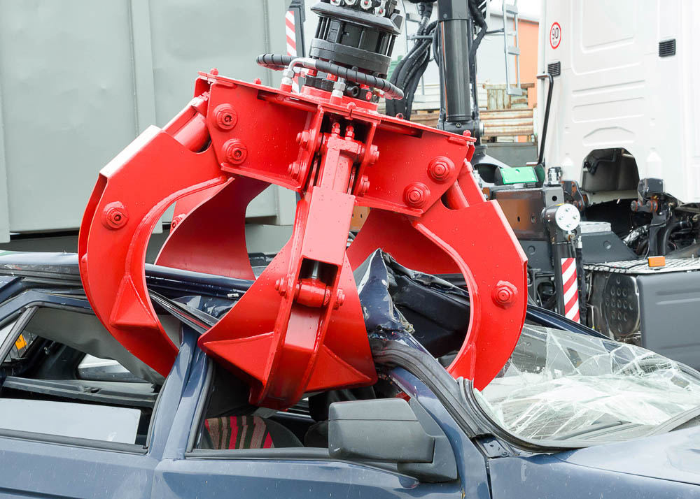 Car battery with green recycle sign.